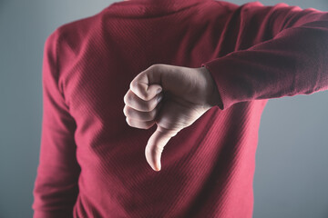 Wall Mural - young guy showing thumbs down