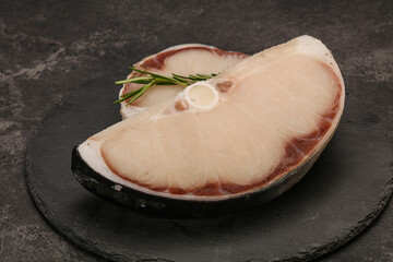 Raw shark steak served rosemary