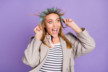 Wall Mural - Photo of excited crazy girl open mouth wind blow hair scram wear blue beret coat isolated purple color background