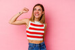 © Asier - Young caucasian woman isolated on pink background celebrating a victory, passion and enthusiasm, happy expression.