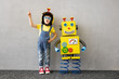 Leinwandbild Motiv Happy child with toy robot