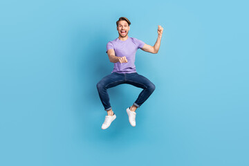 Sticker - Full length body photo of young man jumping high imagine riding horse isolated on pastel blue color background