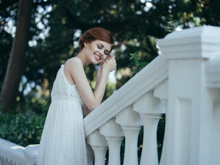 Beautiful woman in white dress classic style and luxury charm nature vacation