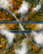 © AmazingAerialAgency - Aerial view of the clouds settling down to bring rain on the New England Fall colors at Connecticut, USA