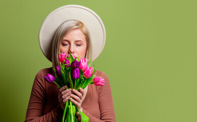 Sticker - Beautiful woman in a hat with tulips bouquet