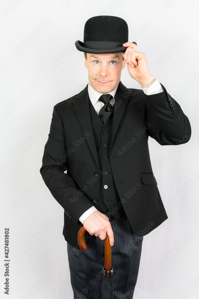 Portrait of Man in Dark Suit and Umbrella Politely Doffing Bowler Hat ...