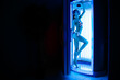 Wide angle in dark room. pretty woman or cute girl with sexy naked healthy body standing in solarium spa salon.