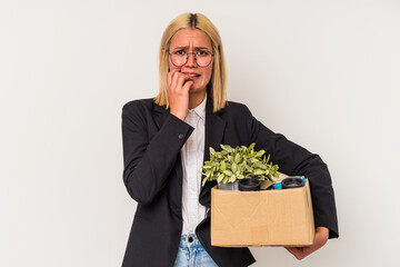 Young venezuelan woman fired from work isolated on white background biting fingernails, nervous and very anxious.