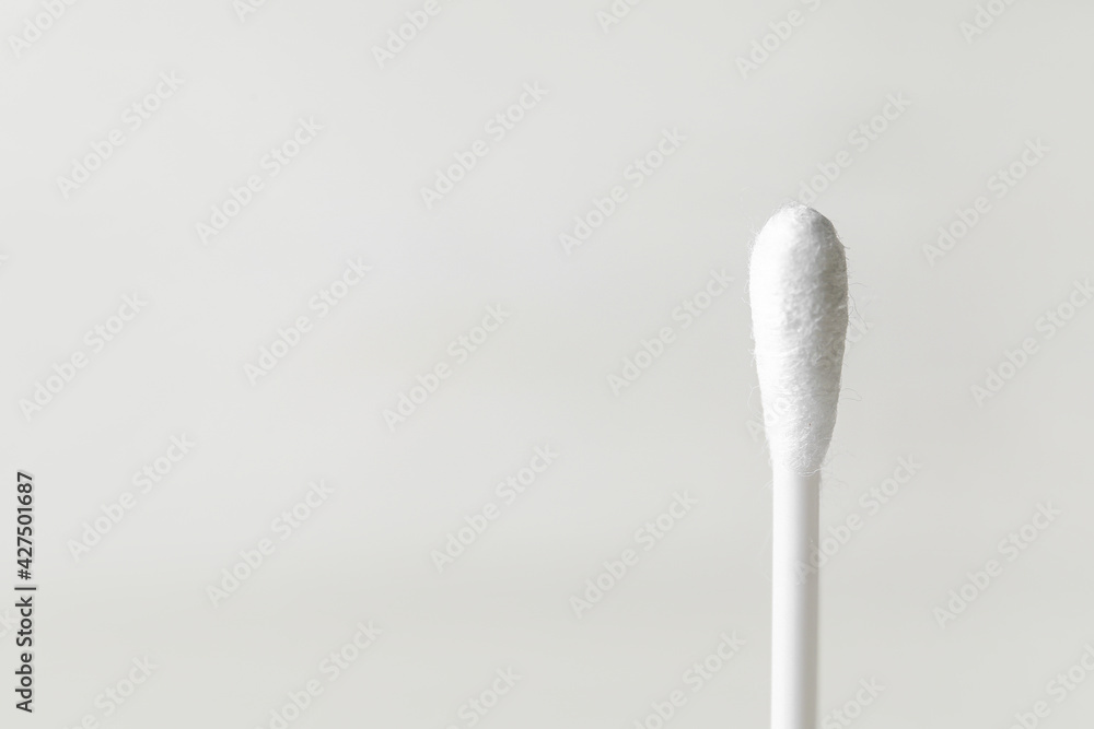 Cotton swab on light background, closeup