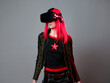 © Ulia Koltyrina - Games and virtual reality, a young red-haired woman uses a VR helmet portrait