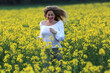 © fotoXS - woman portrait with yellow flowers field background