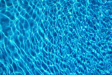 Poster - Blue water in swimming pool with sun reflection