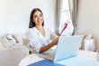 © Graphicroyalty - Smiling young woman study at home with laptop,online research for coursework, online education e-learning concept, Young business woman having conference call with client on laptop.