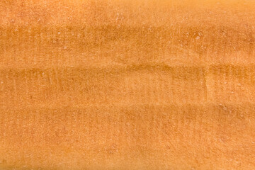 Fresh long loaf texture bakery background, close-up