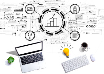 Business growth analysis with computers with a light bulb