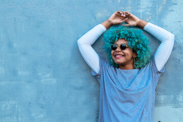 Wall Mural - smiling happy afro american girl on the street