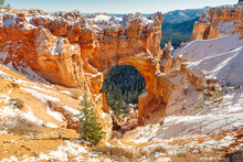 Natural Stone Bridge, Arch At Bryce Canyon With Snow