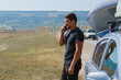 © aaalll3110 - a man makes a phone call. the tourist stopped on the road. travel by car. calling for car repairs