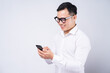 © Timeimage - Asian businessman using smartphone on white background
