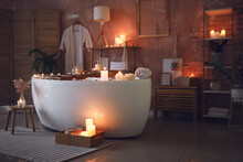 Interior Of Modern Bathroom With Burning Candles In Evening