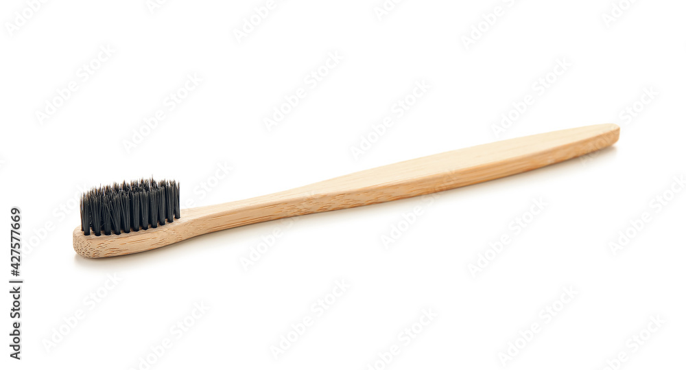 Wooden tooth brush on white background