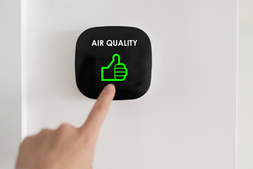 good air quality indoor smart home domotic touchscreen system. air. woman touching touchscreen check
