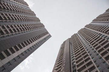 Wall Mural - Low angle shot of high-rise apartment buildings against a sky