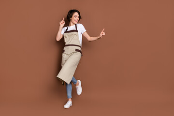 Sticker - Full size photo of cheerful charming lady toothy smile enjoy dancing isolated on brown color background