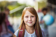 © liderina - Portrait of cheerful girl with red hair smiling towards camera.