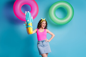 Sticker - Photo of pretty funky woman dressed pink tank-top smiling rising big water gun isolated blue color background