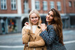 © liderina - Portrait of two women on the street. Looking at camera.