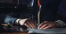 Close Up Shot Of Experienced Tailor Is Sewing Custom Handmade High Quality Apparel In Ancient Luxury Traditional Tailoring Workshop. Concept Of Industry, Handmade, Hand Craft, Couturier And Tradition.