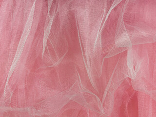 Wall Mural - Pink tulle fabric texture top view. Coral background. Fashion rose color trendy feminine tutu skirt flat lay, female blog glossy backdrop for text sign design. Girly abstract wallpaper,textile surface