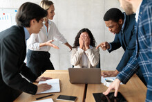 Displeased Business People Shouting At Unhappy Female Employee In Office