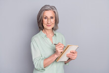 Photo Of Happy Lovely Pretty Smiling Mature Woman Author In Glasses Writing In Notebook Isolated On Grey Color Background