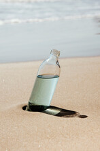 Reusable Water Bottle On A Lonley Beach