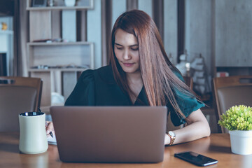 Wall Mural - working women use computer laptop on desk, work from home concept, business women on desk