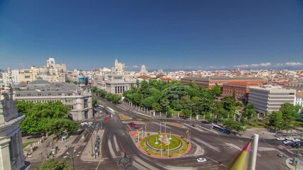 Wall Mural - Aerial view of Cibeles fountain at Plaza de Cibeles in Madrid timelapse with traffic on circle in a beautiful summer day from Cibeles Palace, Spain