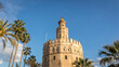 Detail of the Torre del Oro in Seville Spain. The Golden Tower next to the palm trees