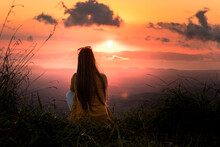 Silhouette Of Woman Watching Beautiful Sunset