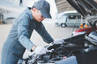 © photobuay - Mechanic with scan tool diagnosing car in open hood. Auto mechanic working. Repair service.