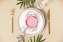 Composition With Cutlery, Plate, Measuring Tape And Alarm Clock On Color Background. Diet Concept
