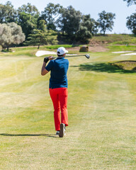 Sticker - Young Caucasian male playing golf on a professional golf course