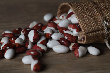 Wall Mural - colored beans scattered on a vintage table