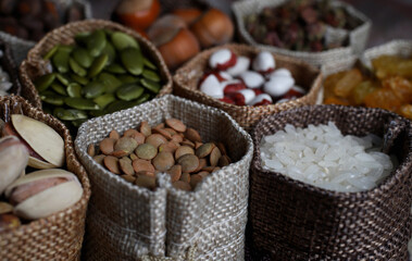 Sticker - shop counter with a selection of nuts and cereals in vintage bags