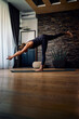 © chika_milan - Flexible fit woman doing yoga at home during a corona virus outbreak. Healthy lifestyle