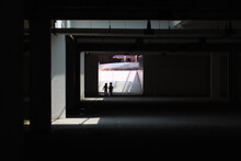 Silhouette People Walking In Corridor Of Building