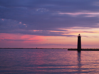 Multicolored sunset behind Muskegon Michigan lighthouse