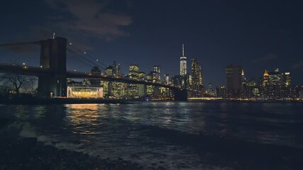 Fototapete - Brooklyn bridge and Manhattan at night
