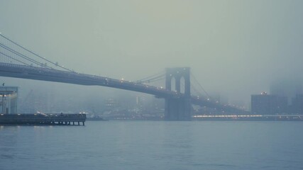 Fototapete - Brooklyn bridge at foggy morning